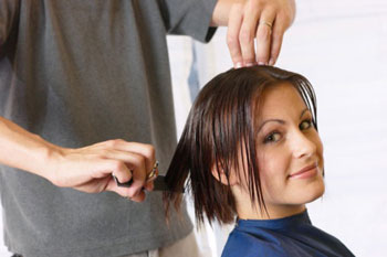 woman getting hair cut